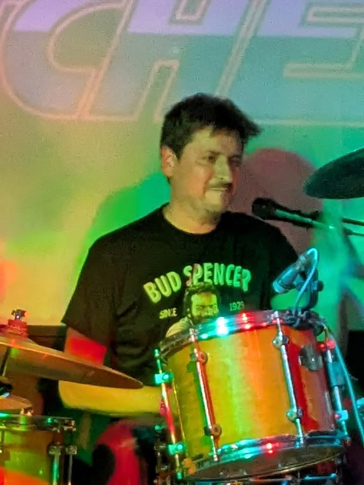 Paul playing drums for Mitch's Bitches wearing a Bud Spencer shirt