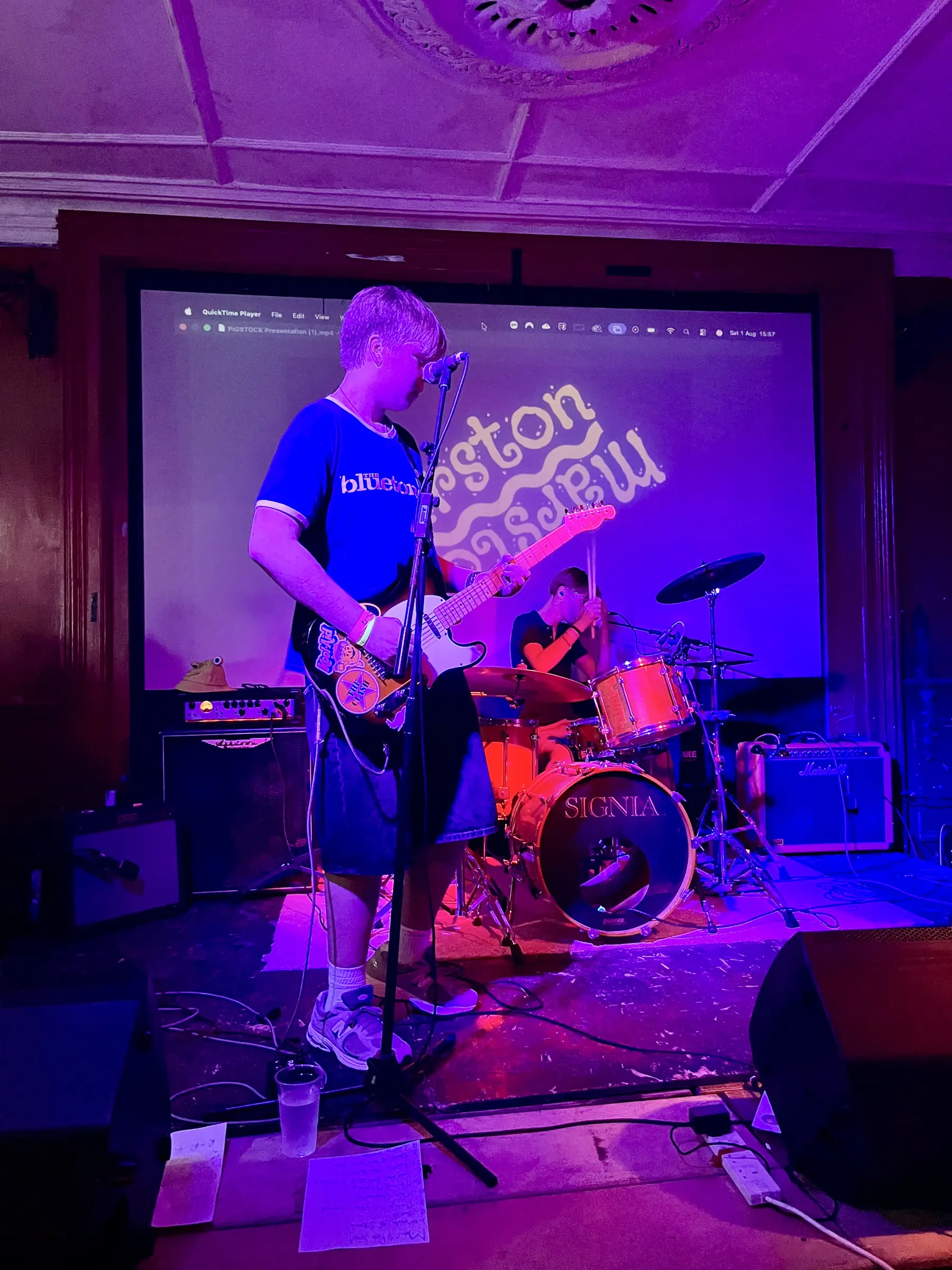 Marston on stage in purple